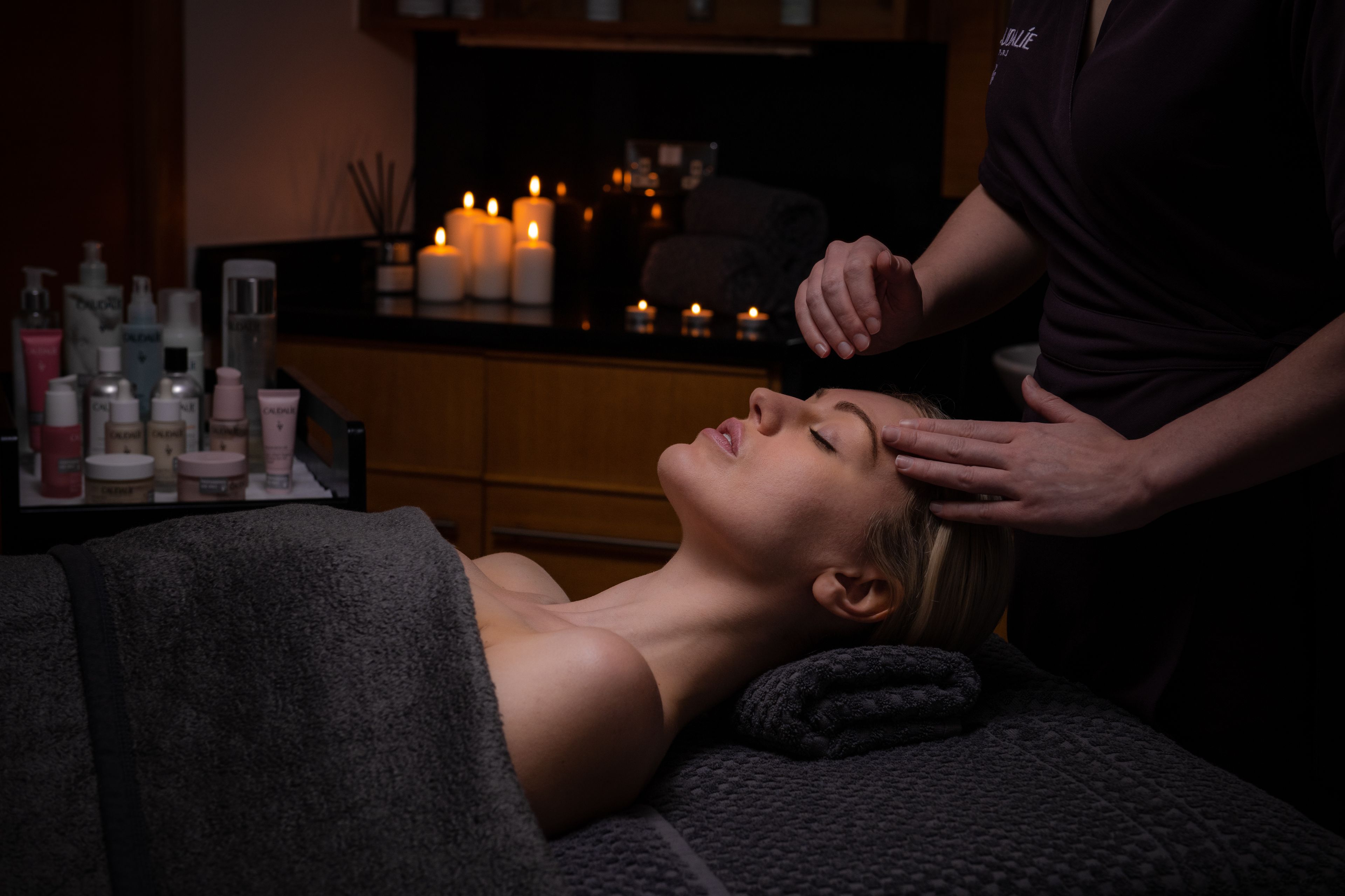 A lady receiving a head massage