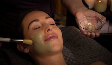 Spa facial treatment applying face mask